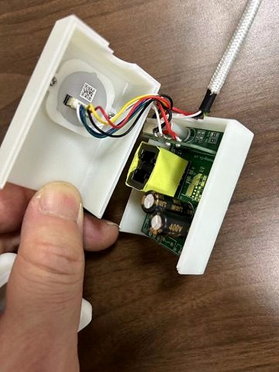 Charlie Charger prototype teardown showing PCB, fingerprint sensor module, and wiring inside 3D-printed enclosure